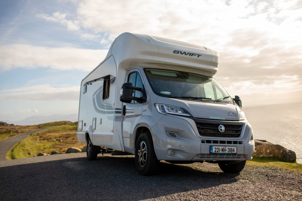 campervan pulled in on a country road alongside irelands coast